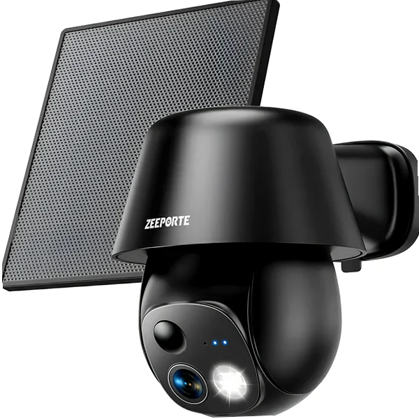 White solar pan/tilt security camera mounted on backyard exterior wall with solar panel