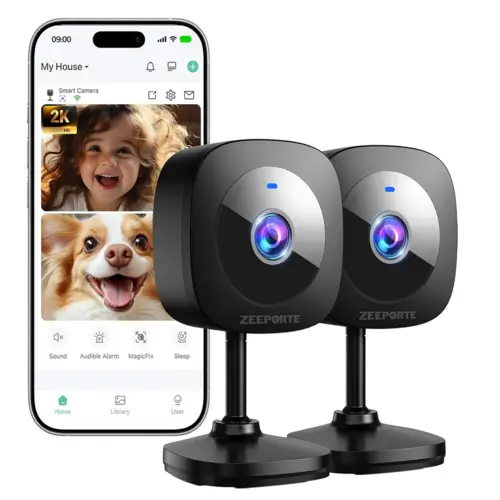 Small reflective-backed mini security camera mounted by a doorway